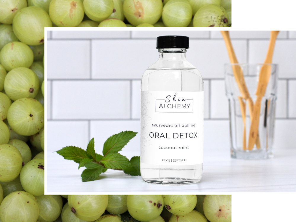 Bottle of 'Skin Alchemy' oral detox product with green grapes in the background