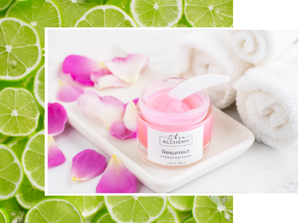 Pink jar of cream on a white plate with flowers and limes in the background