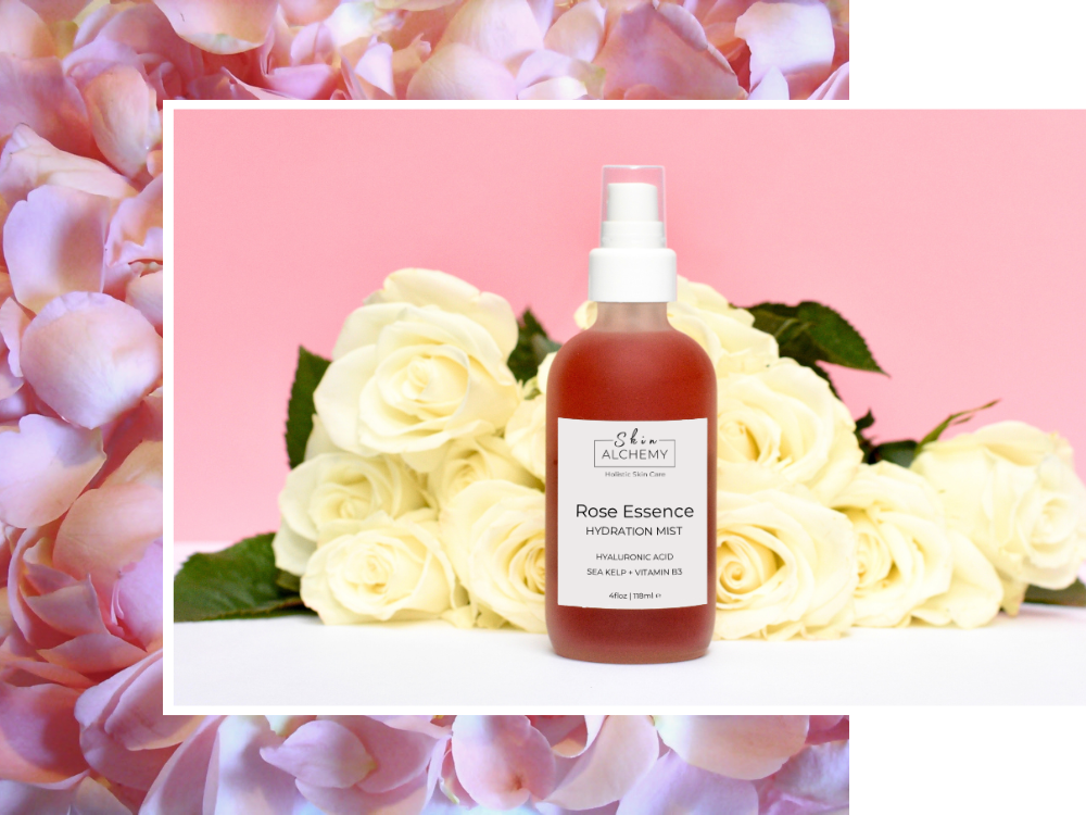 Rose Essence bottle with flowers on a pink background
