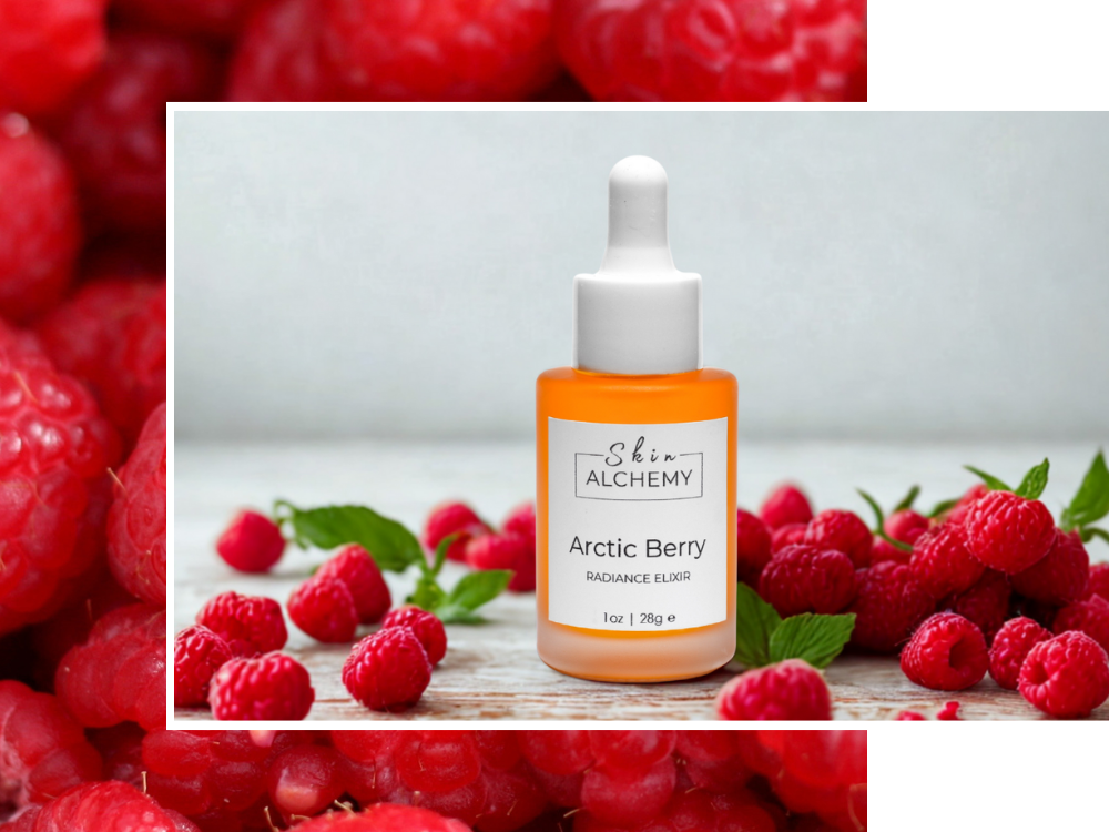 Bottle of 'Arctic Berry' elixir surrounded by raspberries on a wooden surface.