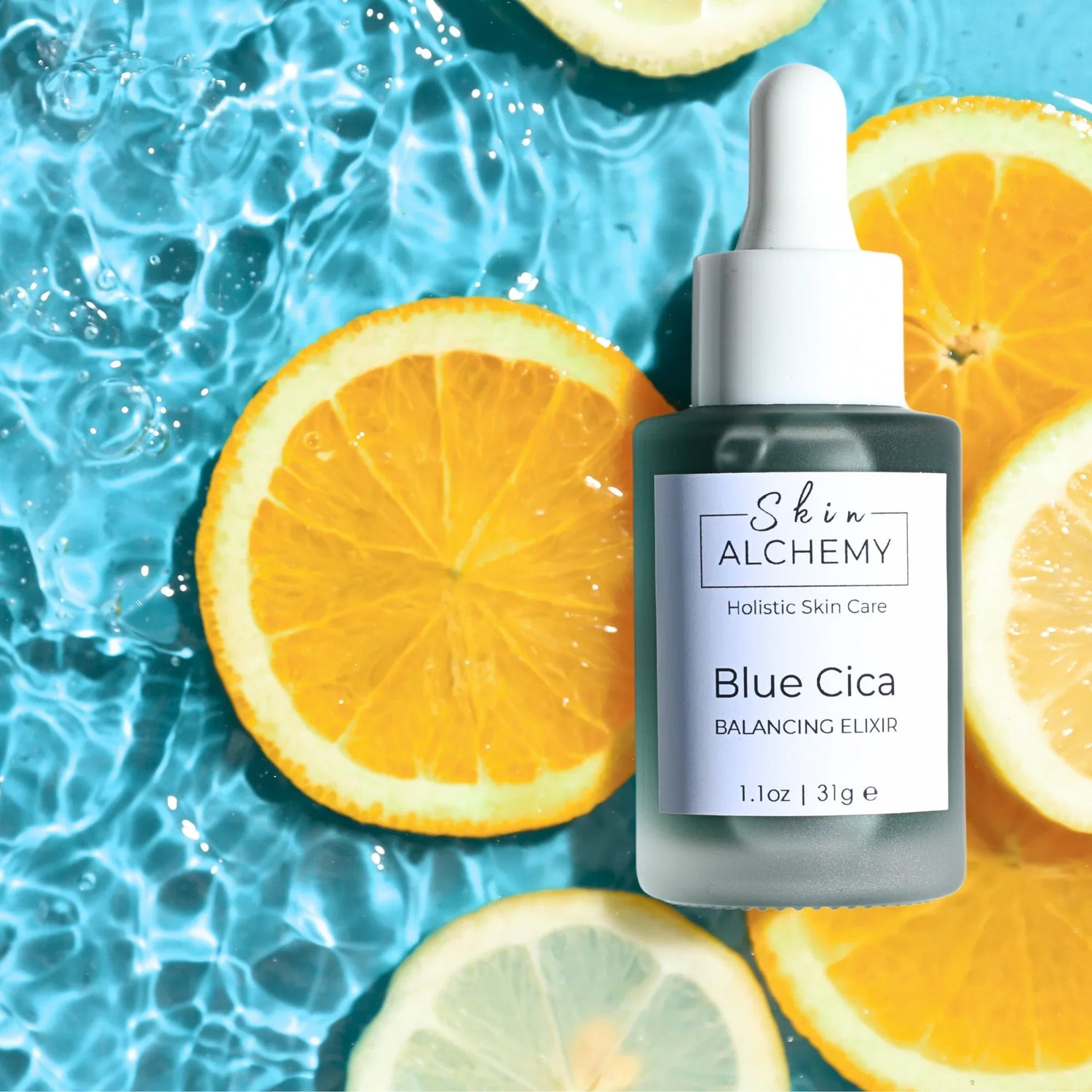 A face oil in a bottle on orange slices on a water drop background