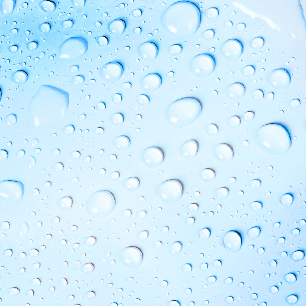 Close-up of water droplets on a blue surface