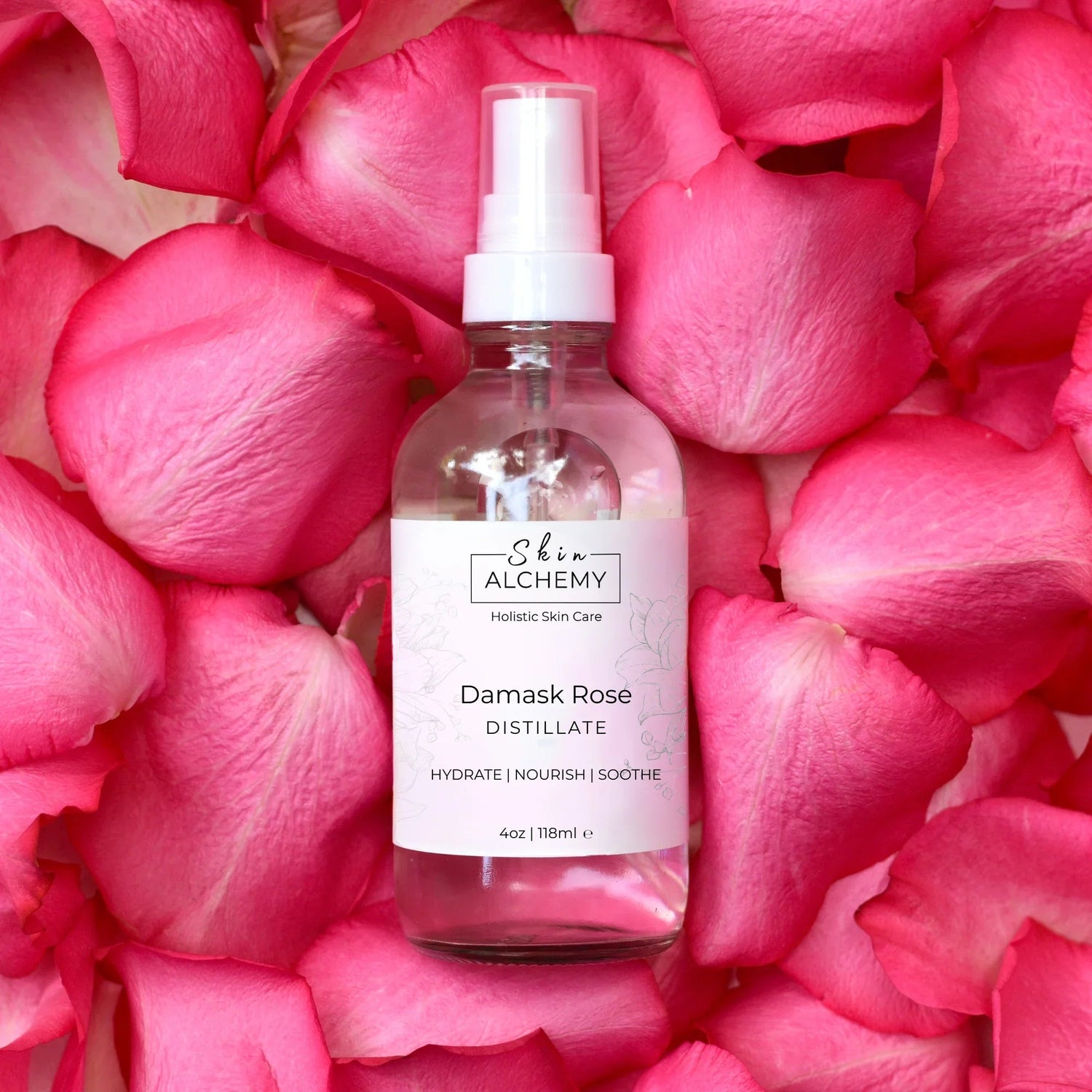 Glass bottle on a bed of rose petals