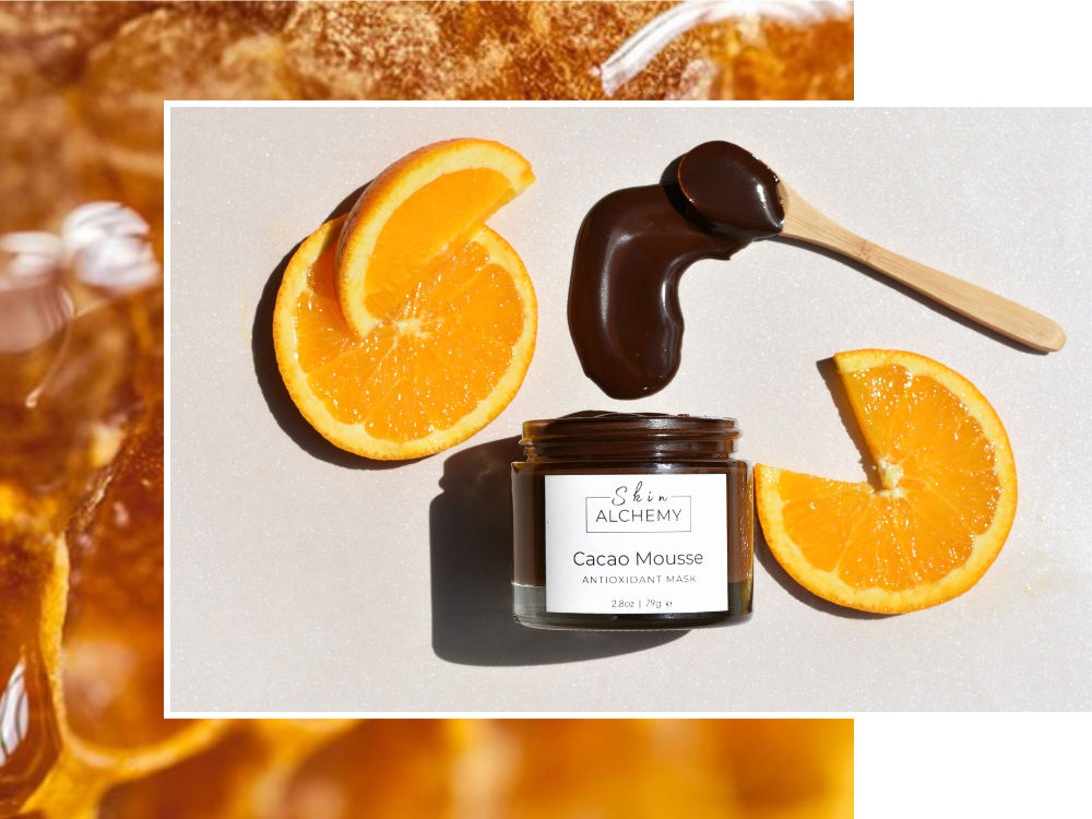 Cacao mousse jar with chocolate and orange slices on a light background