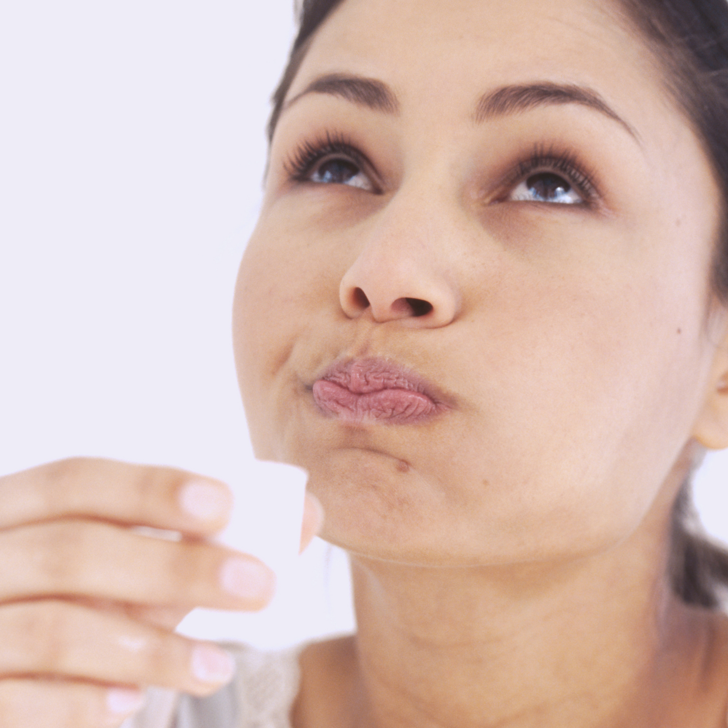 woman swishing liquid in her mouth
