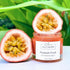 Face cleanser in a jar with passion fruit and green leaves