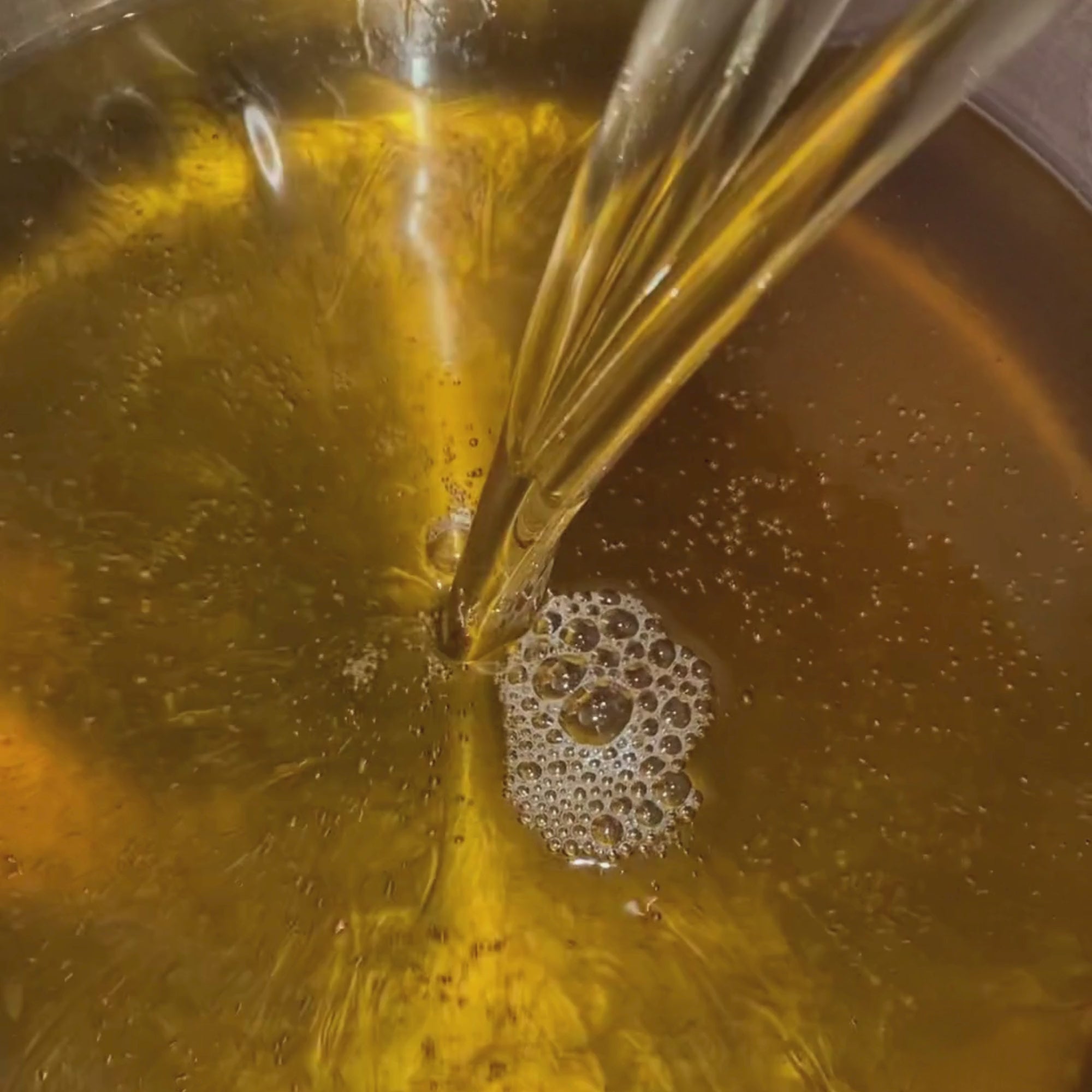 video of oil pouring into a pot | skin alchemy
