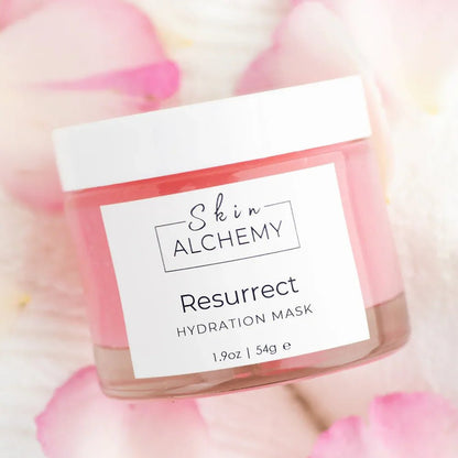 Pink Face mask in a jar on a bed of rose petals